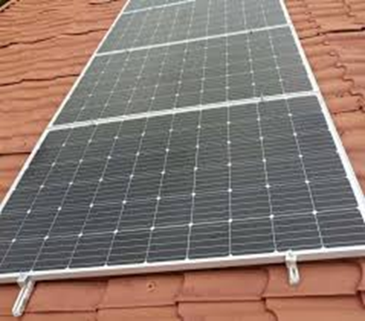 Solar panel mounted on a residential rooftop by Kowatek Solar LTD for clean and reliable electricity in Nigeria